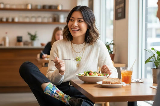 Woman enjoying a meal at a restaurant with a salad and a drink. - Fun baby giraffe socks gift for women by Zeblismapo